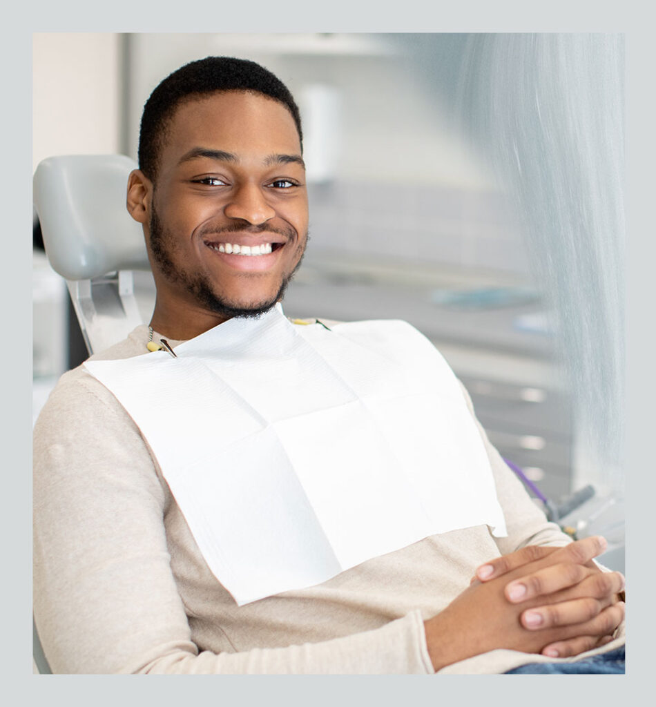 young man in dental chair for wisdom teeth removal